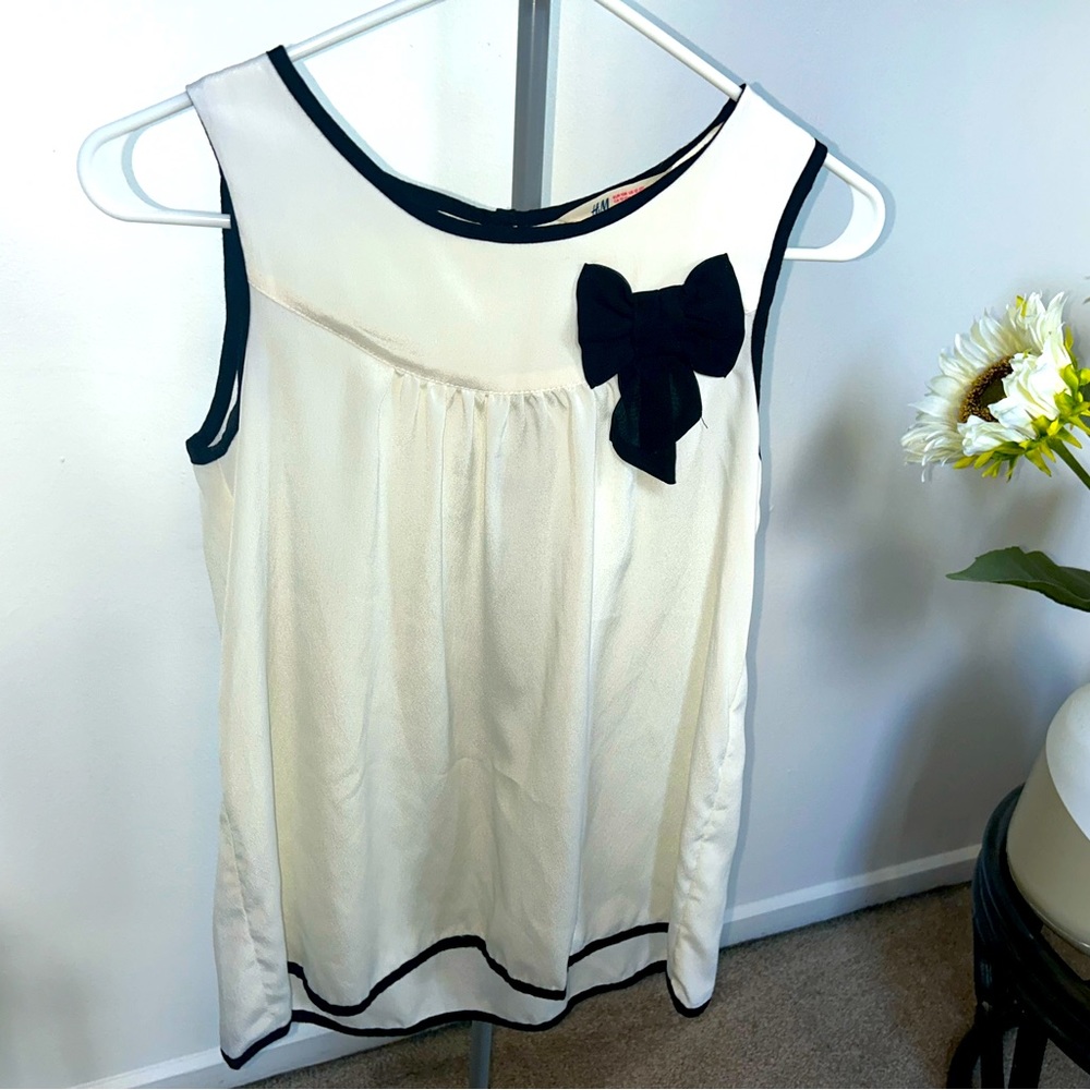 Juniors cream sheer blouse with black bow